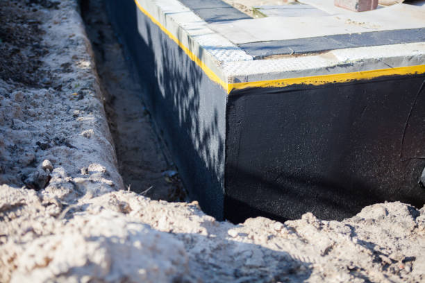 Professional Basement Waterproofing technician working in Lowell, OR